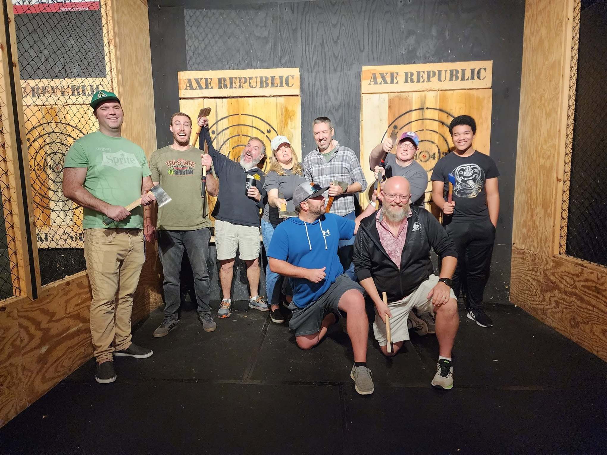 Group of men posing with axes at Axe Republic venue.
